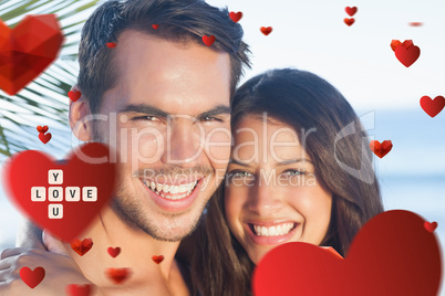 Composite image of cheerful loving couple having holidays
