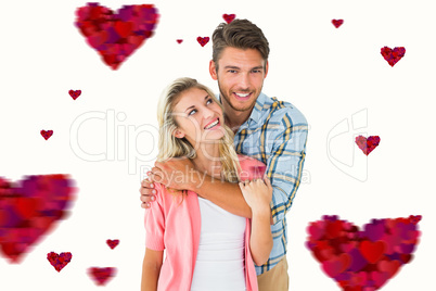 Composite image of attractive young couple smiling together Composite image of attractive young couple smiling together