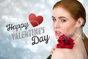 Composite image of beautiful redhead posing with red rose