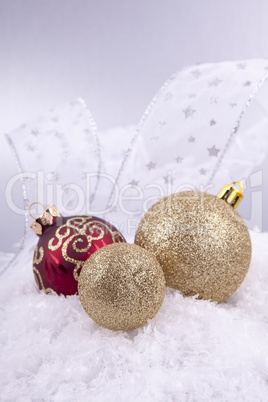 beautiful gold and red christmas decoration on white snow