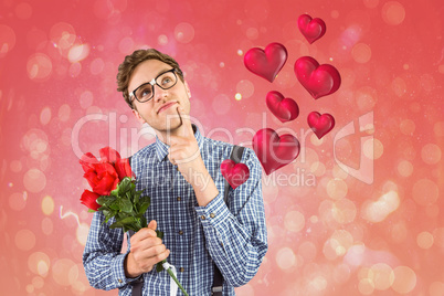 Composite image of geeky hipster holding a bunch of roses