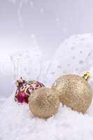 beautiful gold and red christmas decoration on white snow