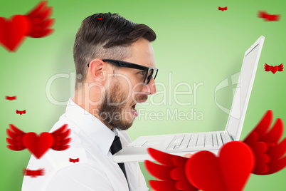 Composite image of geeky frustrated businessman looking at his l