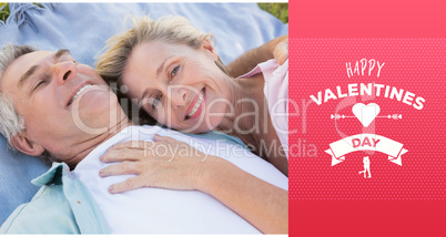 Composite image of happy senior couple cuddling on blanket