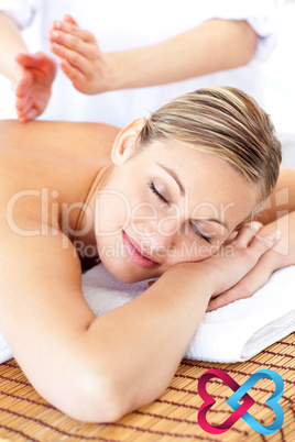 Composite image of attractive woman receiving a tapping massage