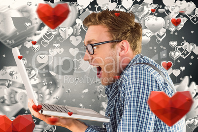 Composite image of geeky businessman using his laptop