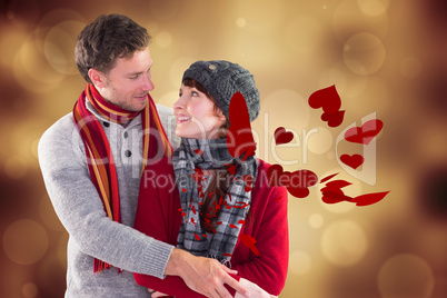 Composite image of smiling couple looking at each other