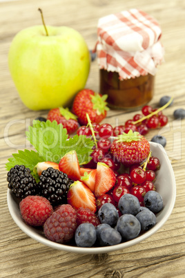 fresh tasty berry collection on table in summer