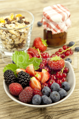 fresh tasty berry collection on table in summer