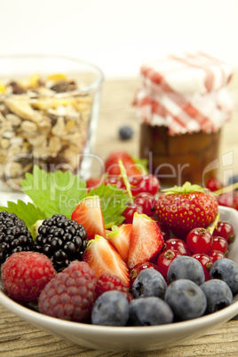 fresh tasty berry collection on table in summer