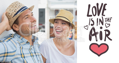 Composite image of young hip couple sitting on bench