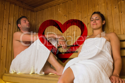 Composite image of happy couple relaxing in a sauna