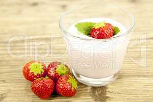 fresh tasty strawberry yoghurt shake dessert on table