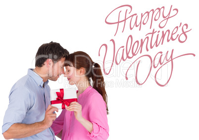 Composite image of loving couple holding a gift