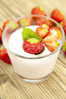 fresh tasty strawberry yoghurt shake dessert on table