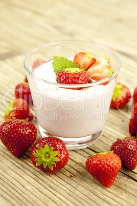 fresh tasty strawberry yoghurt shake dessert on table