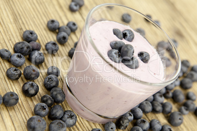 fresh delicious blueberry yoghurt shake dessert on table