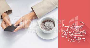 Composite image of businesswoman using smartphone with coffee