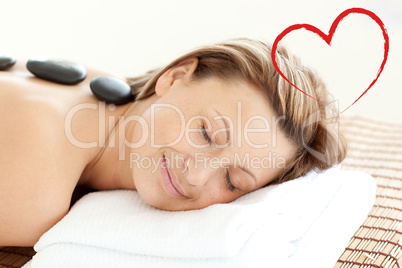 Composite image of beautiful woman receiving a spa treatment