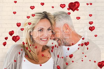 Composite image of happy couple laughing together woman looking