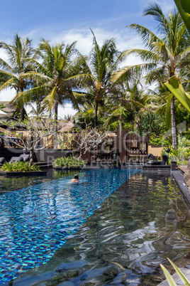 Person swimming in a pool in Bali