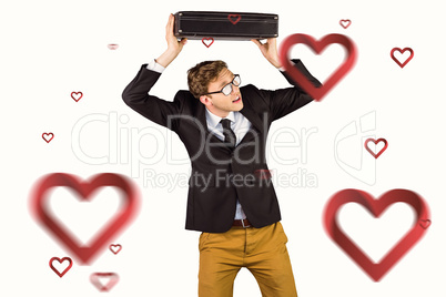 Composite image of young geeky businessman holding briefcase