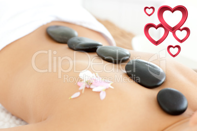 Composite image of close up of a woman receiving a spa treatment