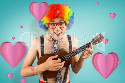 Composite image of geeky hipster in afro rainbow wig playing gui