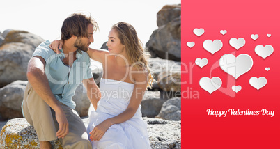 Composite image of gorgeous couple embracing at the coast