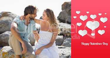 Composite image of gorgeous couple embracing at the coast