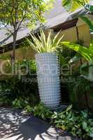 Ornate column in formal Balinese garden