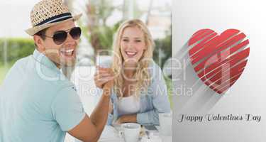 Composite image of hip young couple having coffee together