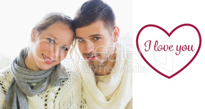 Composite image of close up portrait of a loving couple in winte