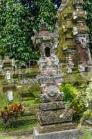 Ornate column in formal Balinese garden