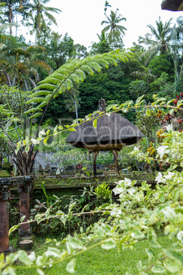 Ornate column in formal Balinese garden