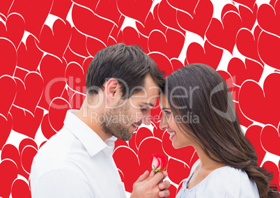 Composite image of handsome man offering his girlfriend a rose