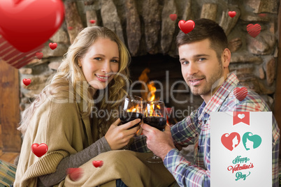 Composite image of romantic couple toasting wineglasses in front
