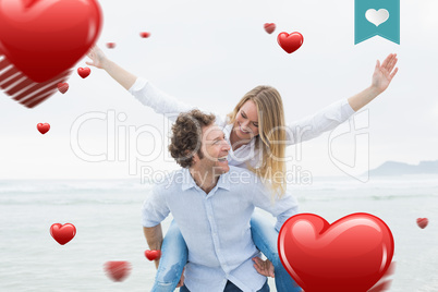 Composite image of man piggybacking woman at beach