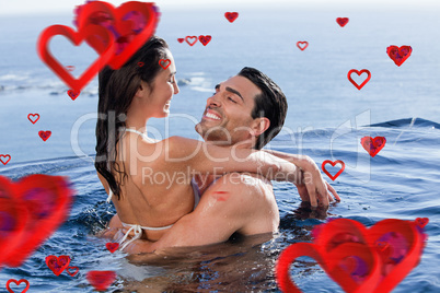 Composite image of cute couple cuddling each other Composite image of cute couple cuddling each other