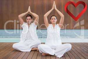 Composite image of attractive couple in white sitting in lotus p