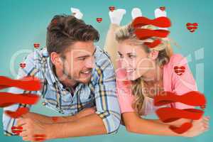 Composite image of attractive young couple smiling at each other