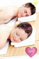 Composite image of resting couple lying on a massage table