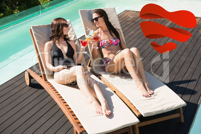 Composite image of women holding drinks by swimming pool