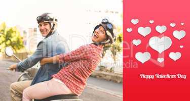 Composite image of happy mature couple riding a scooter in the c