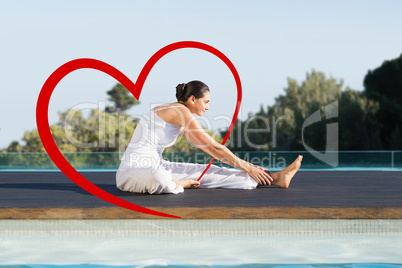 Composite image of peaceful brunette in janu sirsasana yoga pose