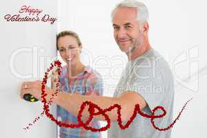Composite image of happy couple making some measurements togethe
