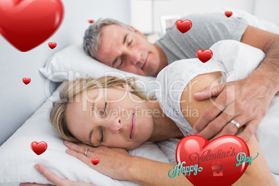 Composite image of couple sleeping and spooning in bed