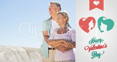 Composite image of happy senior couple embracing on the pier