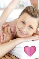Composite image of cheerful woman enjoying a back massage