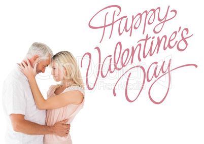 Composite image of affectionate couple standing and hugging